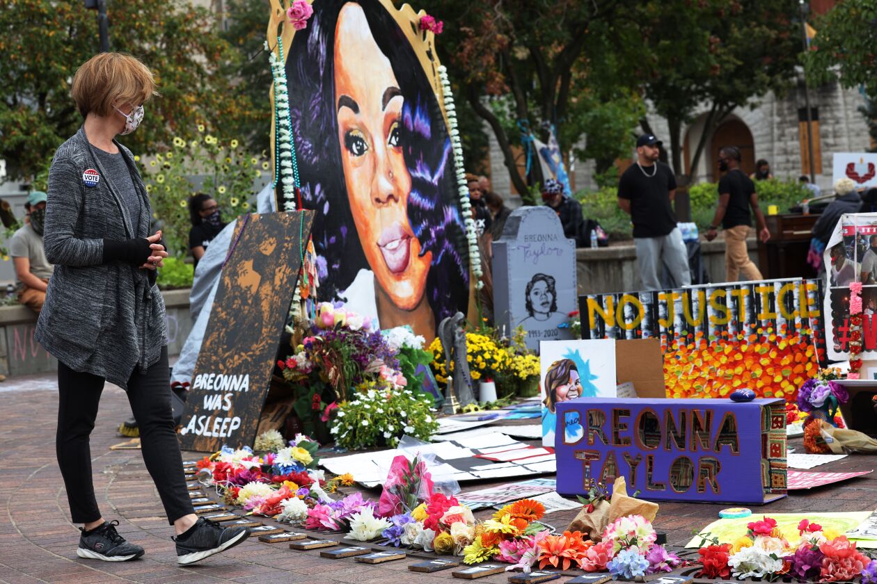 A woman stops at the memorial for Breonna Taylor in Jefferson Square Park in September in Louisville, Kentucky.